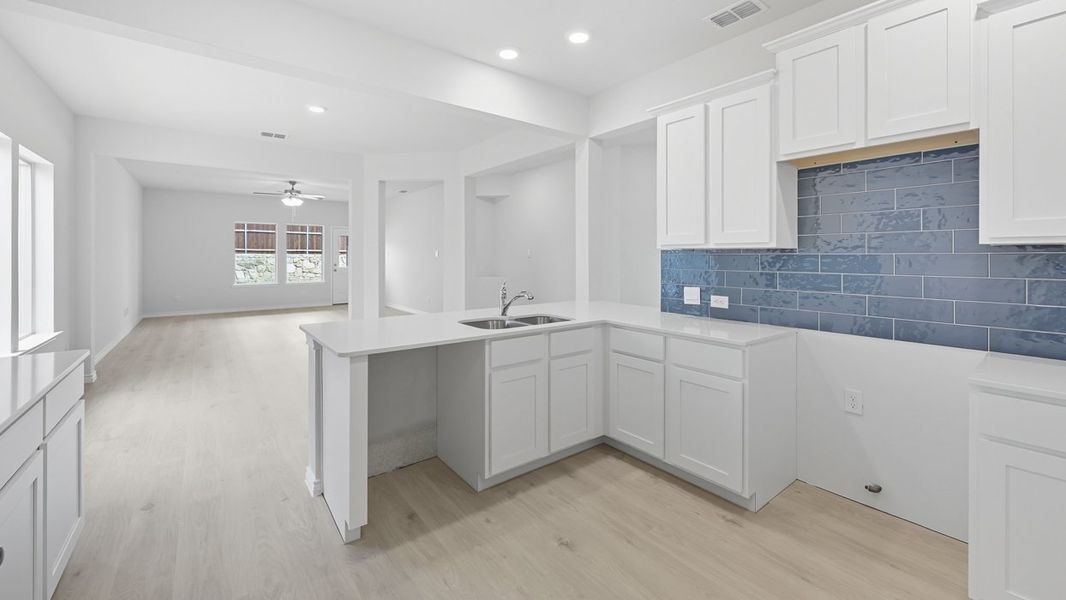 Representative furnished interior of a home built from the Tanzanite by D.R. Horton in Silverado, Aubrey (Image 5).