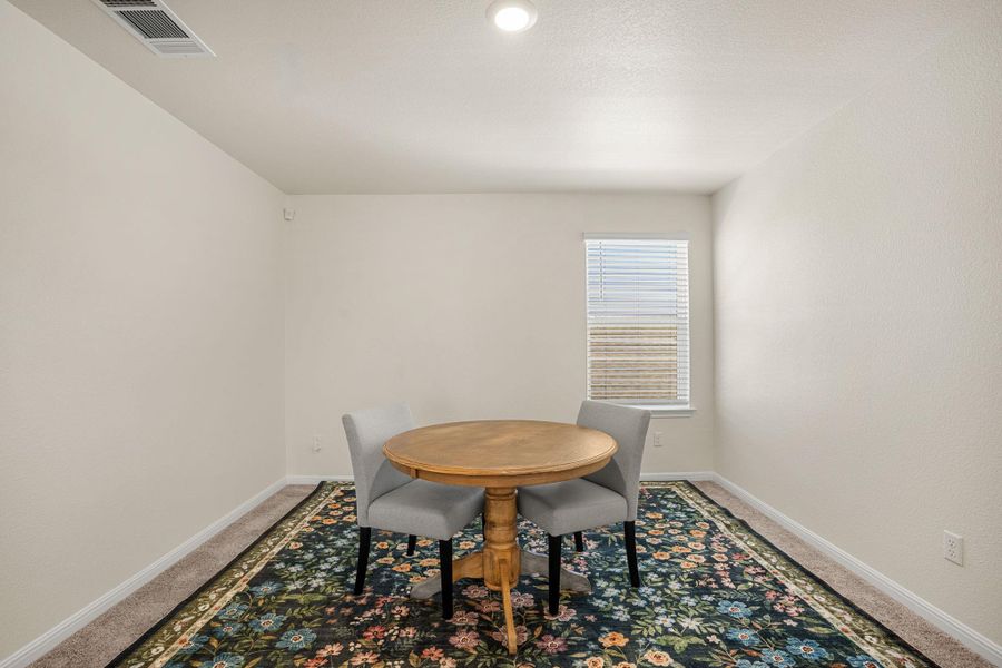 A versatile bonus room offers abundant light, perfect for a cozy breakfast nook or a quiet study area.