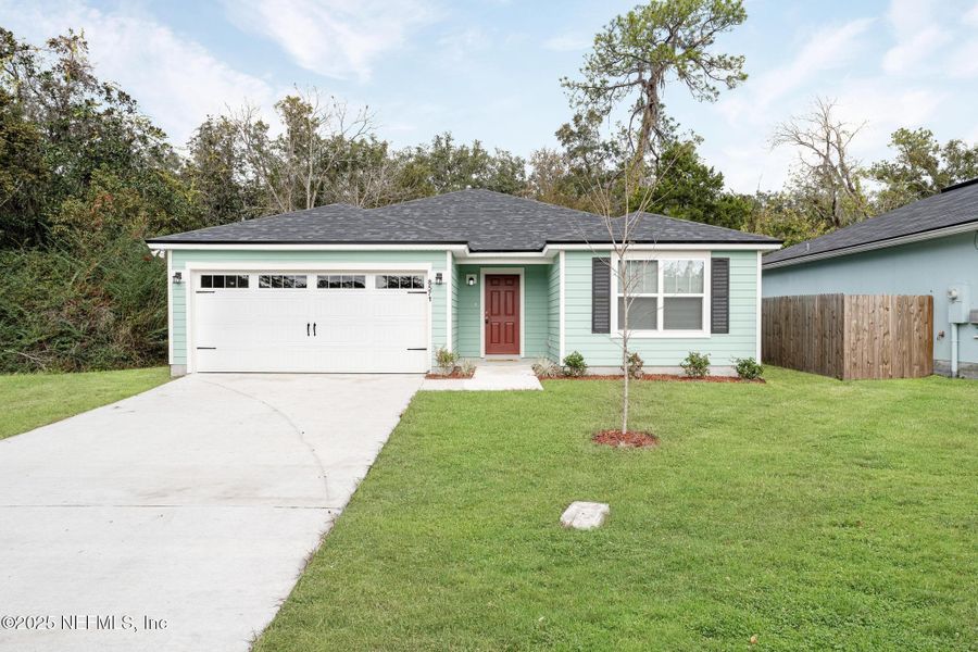 Front exterior of a new home in , Jacksonville, FL, highlighting curb appeal (Image 1). Front exterior of a new home in , Jacksonville, FL, highlighting curb appeal (Image 1).