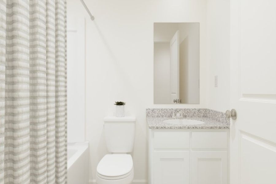 A bathroom with a sink and toilet.