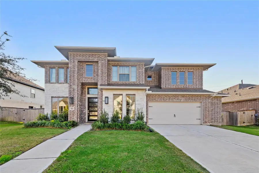 Front exterior of a new home in Fulbrook On Fulshear Creek 60', Fulshear, TX, highlighting curb appeal (Image 1). Front exterior of a new home in Fulbrook On Fulshear Creek 60', Fulshear, TX, highlighting curb appeal (Image 1).