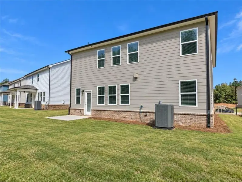 Exterior details and patio area of a home in Kingsmere Estates, Loganville (Image 3).