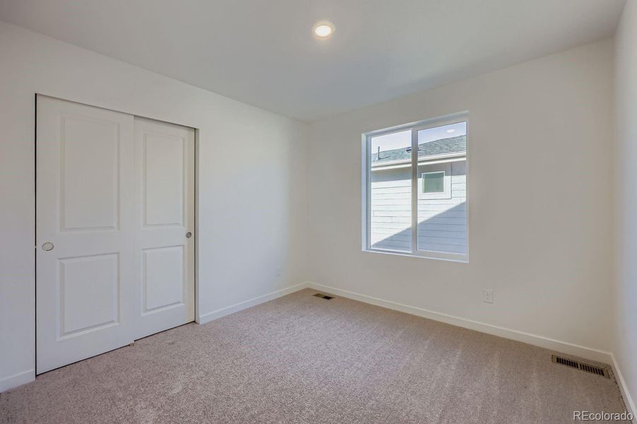 Spacious, unfurnished interior of a new home in Percheron: The Explorer Collection, Colorado Springs (Image 5).