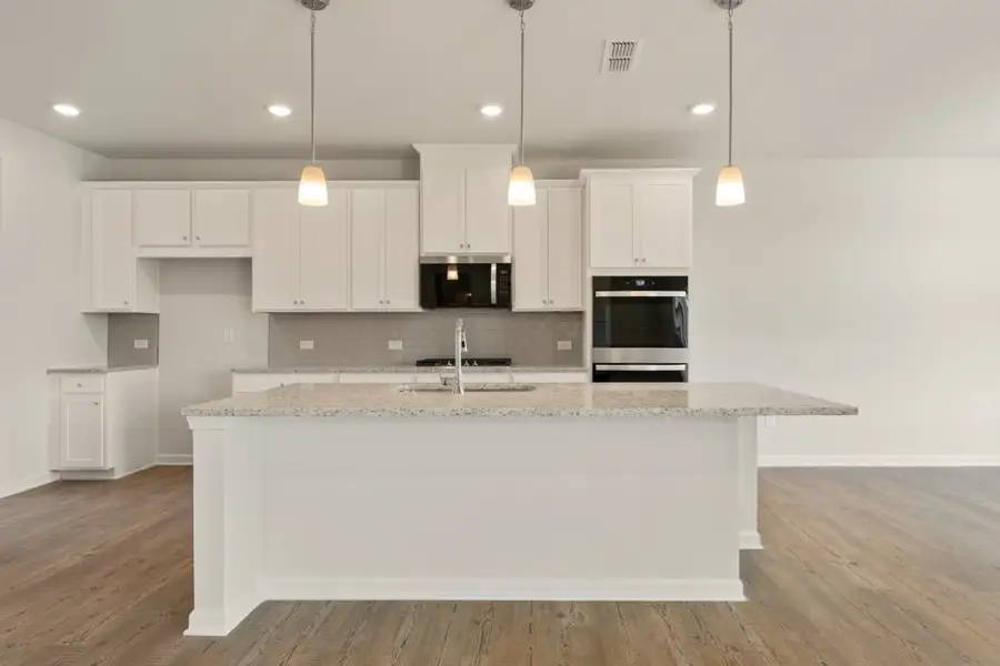 A kitchen with white cabinets. A kitchen with white cabinets.