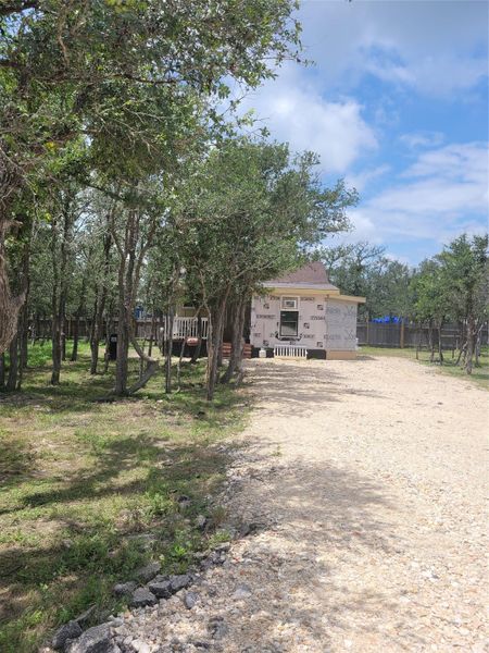 A quaint residence nestled amongst a wooded lot, offering a tranquil retreat. A quaint residence nestled amongst a wooded lot, offering a tranquil retreat.