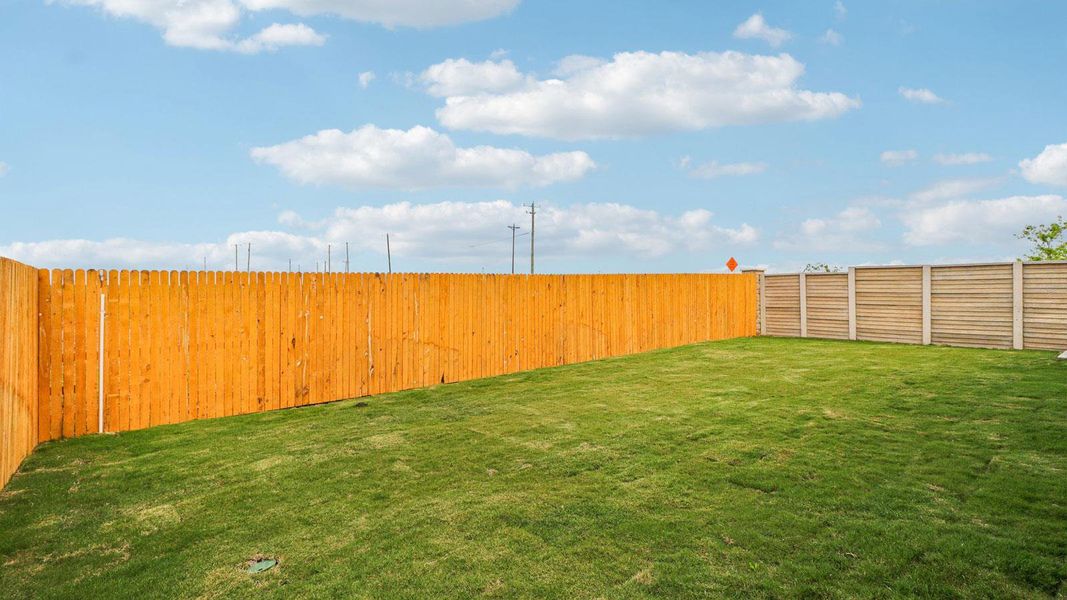 Exterior details and patio area of a home in Monarch Ranch, Manor (Image 3).