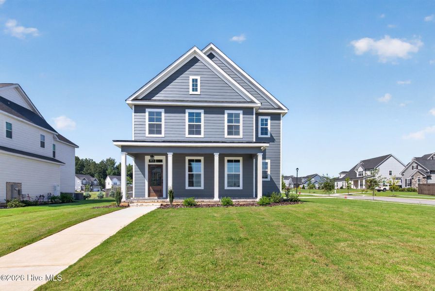Front exterior of a new home in Highland Lakes, Evans, GA, highlighting curb appeal (Image 1). Front exterior of a new home in Highland Lakes, Evans, GA, highlighting curb appeal (Image 1).