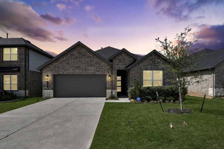 Front exterior of a new home in Hills of Westlake, Conroe, TX, highlighting curb appeal (Image 2). Front exterior of a new home in Hills of Westlake, Conroe, TX, highlighting curb appeal (Image 2).
