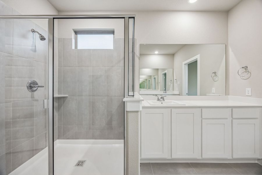 Primary Bathroom in the Wimbledon home plan by Trophy Signature Homes – REPRESENTATIVE PHOTO