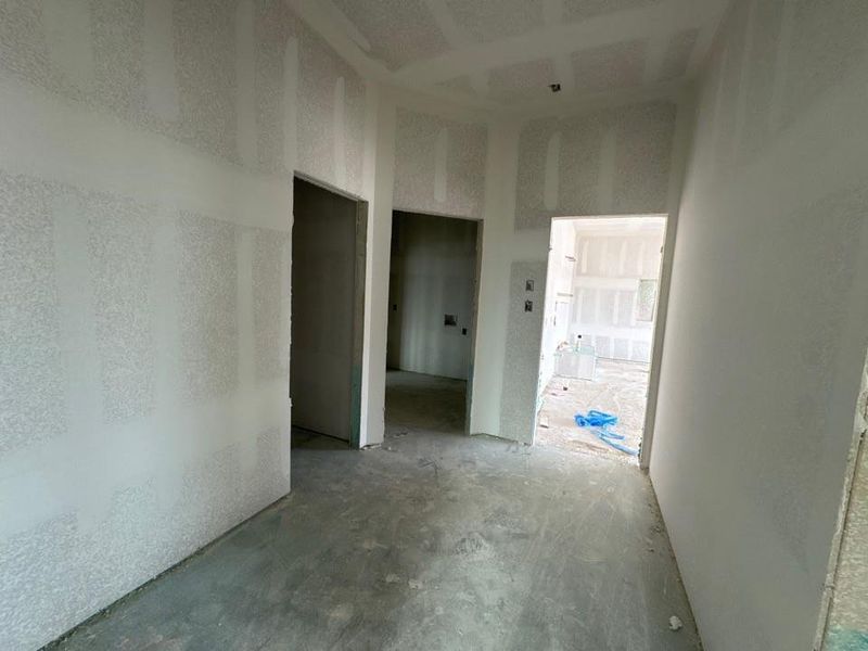 Empty room featuring unfinished concrete floors Empty room featuring unfinished concrete floors