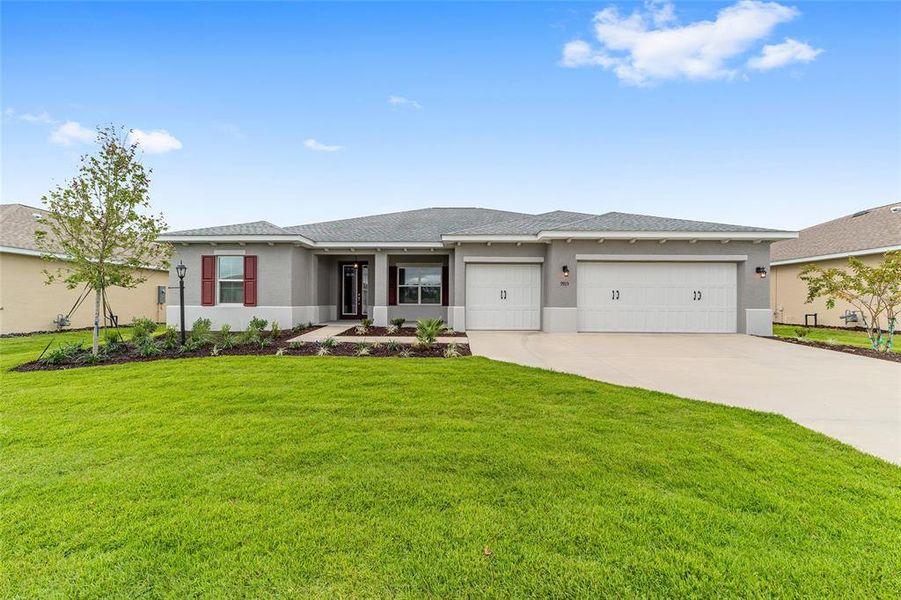Front exterior of a new home in On Top of the World Communities, Ocala, FL, highlighting curb appeal (Image 23). Front exterior of a new home in On Top of the World Communities, Ocala, FL, highlighting curb appeal (Image 23).