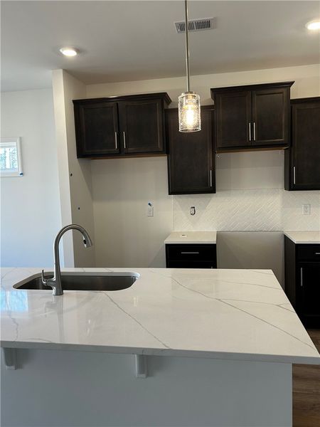 This kitchen showcases a clean and inviting aesthe