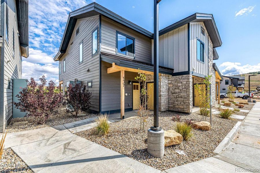 Front exterior of a new home in , Granby, CO, highlighting curb appeal (Image 18).