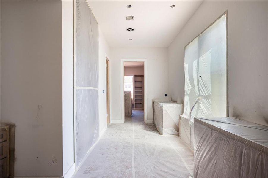 Entrance to Spa Like Ensuite with double vanities, make-up area, over-sized walk-in shower, and stand-alone tub.