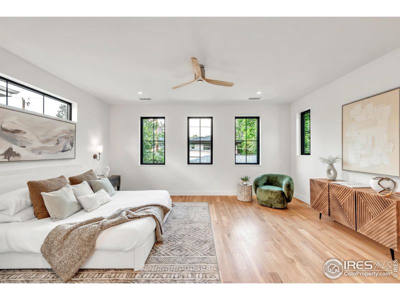 Primary ensuite encompasses the entire north side of the home and envelopes you in luxury, elevating "staycations" to an entirely new level