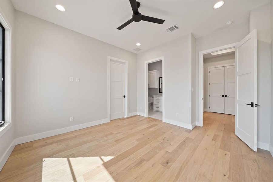 Another view of 2nd bedroom. Large hall closet and 3rd bedroom through the door on the right. Ensuite bathroom in the middle door. Large closet on the left.