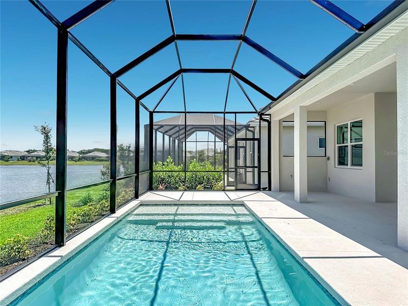 Exterior details and patio area of a home in Watercolor Place, Bradenton (Image 24).