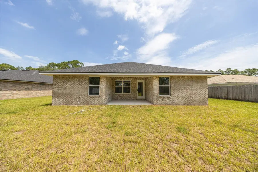 Exterior details and patio area of a home in Palm Coast, Palm Coast (Image 2).