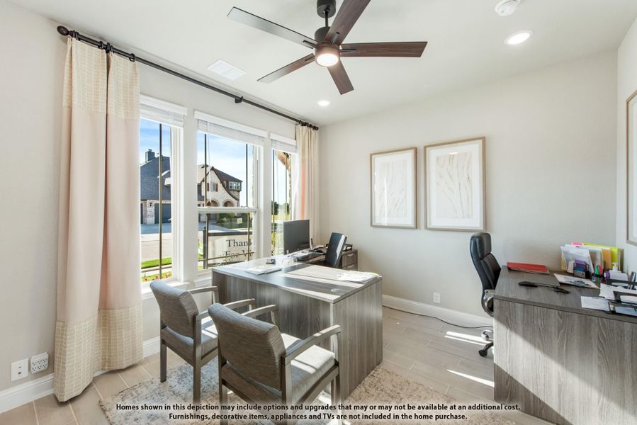 Home office with wood-tone desk, ceiling fan, and large windows overlooking neighborhood Home office with wood-tone desk, ceiling fan, and large windows overlooking neighborhood