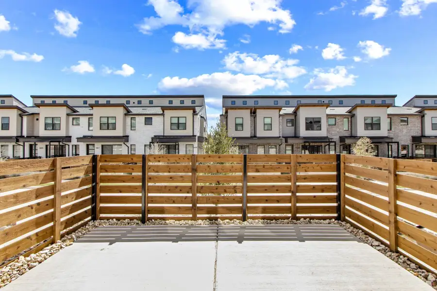 Exterior details and patio area of a home in Willow Grove Townhomes, Melissa (Image 3).