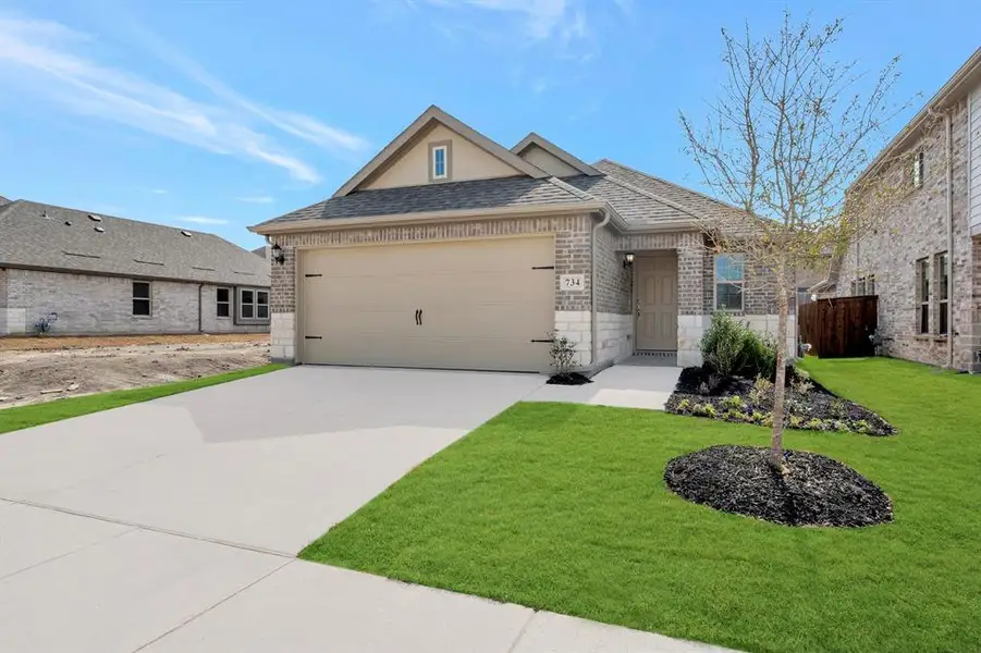 Front exterior of a new home in Elevon, Lavon, TX, highlighting curb appeal (Image 2). Front exterior of a new home in Elevon, Lavon, TX, highlighting curb appeal (Image 2).