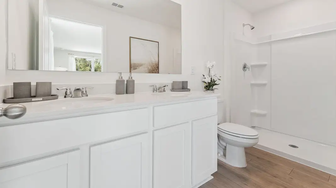 Representative furnished interior of a home built from the PEARSON by D.R. Horton in Fish Lake Cove, Kissimmee (Image 14).