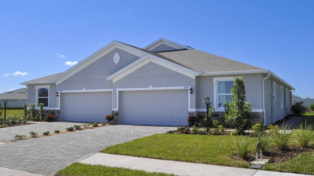 Front exterior of a new home in Coddington, Bradenton, FL, highlighting curb appeal (Image 2). Front exterior of a new home in Coddington, Bradenton, FL, highlighting curb appeal (Image 2).