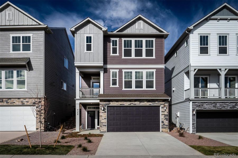 Front exterior of a new home in Trailside at Cottonwood Creek, Colorado Springs, CO, highlighting curb appeal (Image 1).