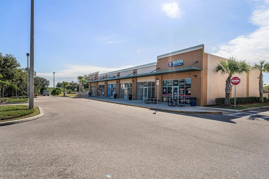 Front exterior of a new home in Groves at Grand Island, Grand Island, FL, highlighting curb appeal (Image 21). Front exterior of a new home in Groves at Grand Island, Grand Island, FL, highlighting curb appeal (Image 21).