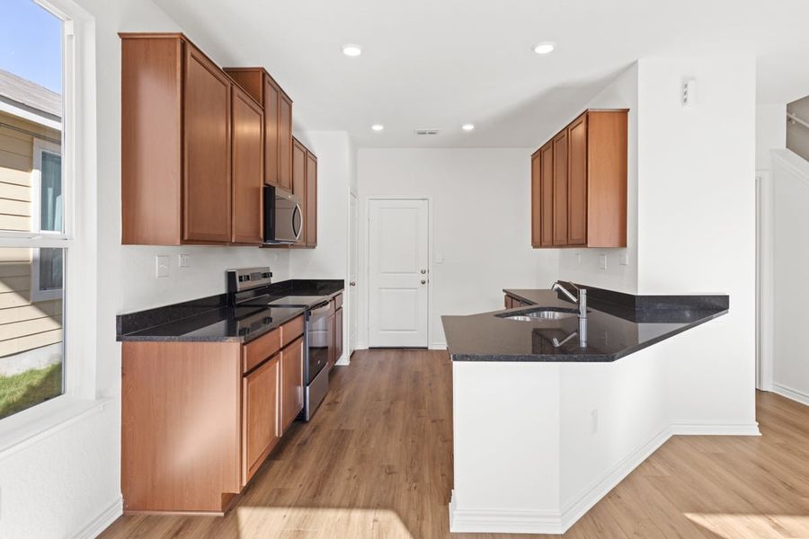 Furnished interior view inside a new home in Spanish Trails Villas, San Antonio (Image 5).