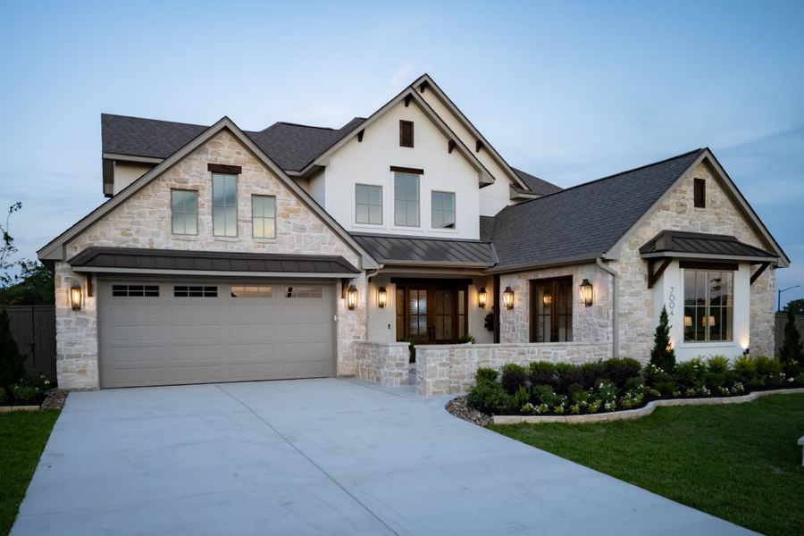 Front exterior of a new home in Stella Ranch, Bryan, TX, highlighting curb appeal (Image 27).