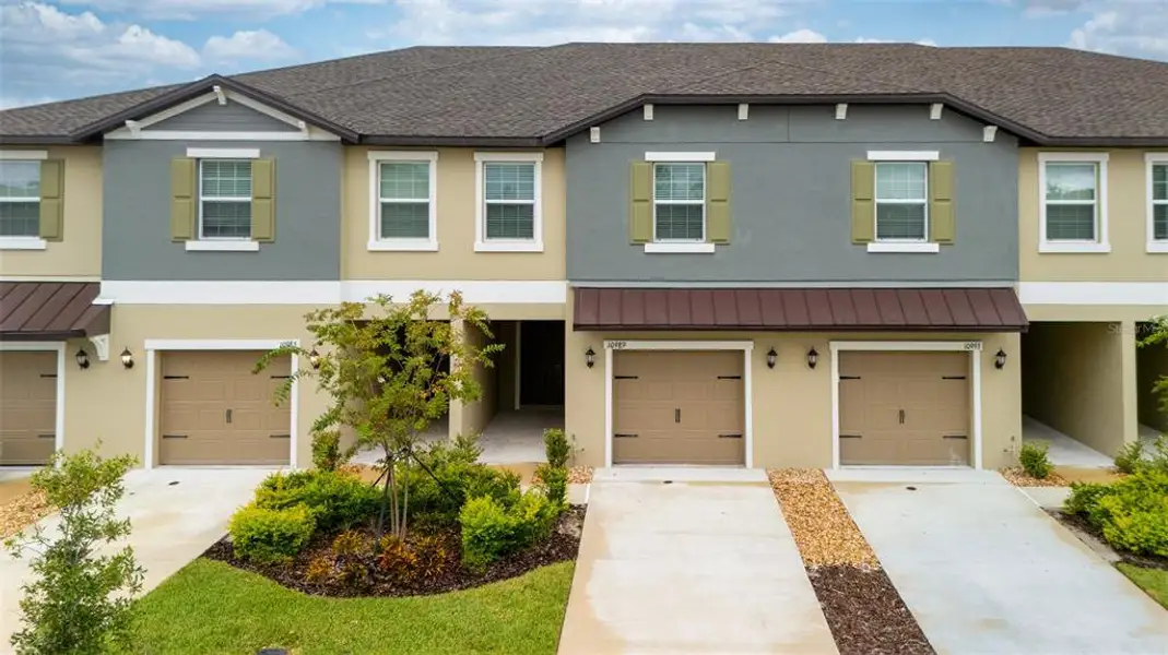 Front exterior of a new home in , Land O' Lakes, FL, highlighting curb appeal (Image 14). Front exterior of a new home in , Land O' Lakes, FL, highlighting curb appeal (Image 14).