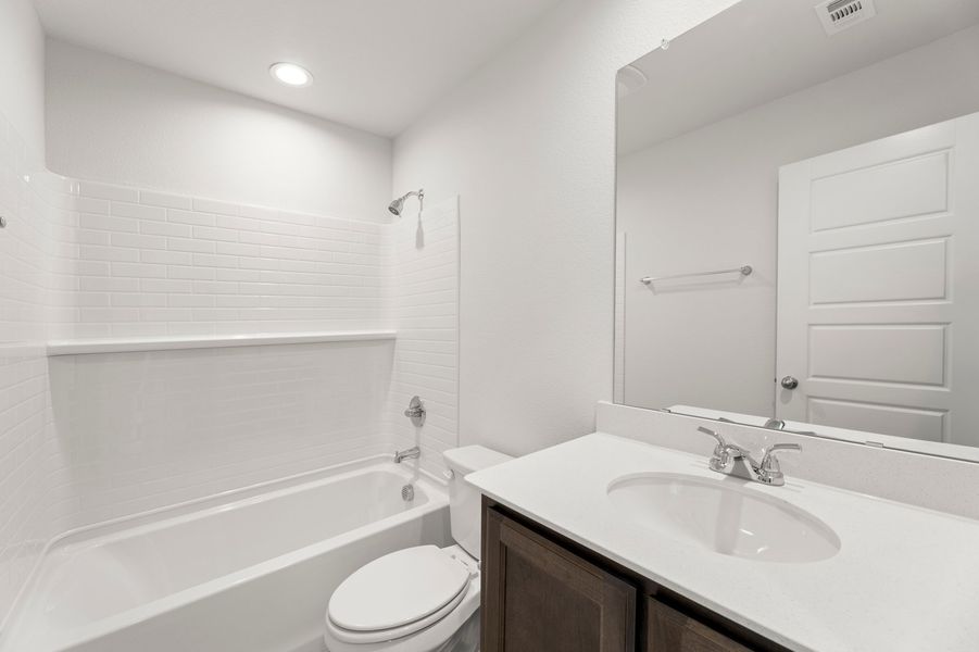 Front exterior of a new home in De Berry Reserve, Royse City, TX, highlighting curb appeal (Image 24). Front exterior of a new home in De Berry Reserve, Royse City, TX, highlighting curb appeal (Image 24).