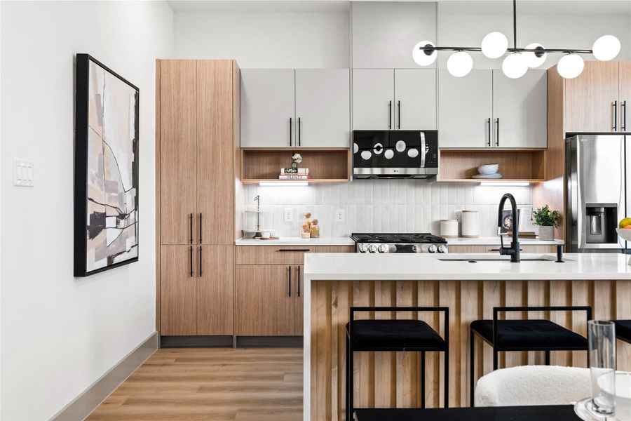 Even from the corner, this kitchen tells a story of modern ease—clean lines, natural wood tones, and light-filled windows create a calming atmosphere you’ll love coming home to. Even from the corner, this kitchen tells a story of modern ease—clean lines, natural wood tones, and light-filled windows create a calming atmosphere you’ll love coming home to.
