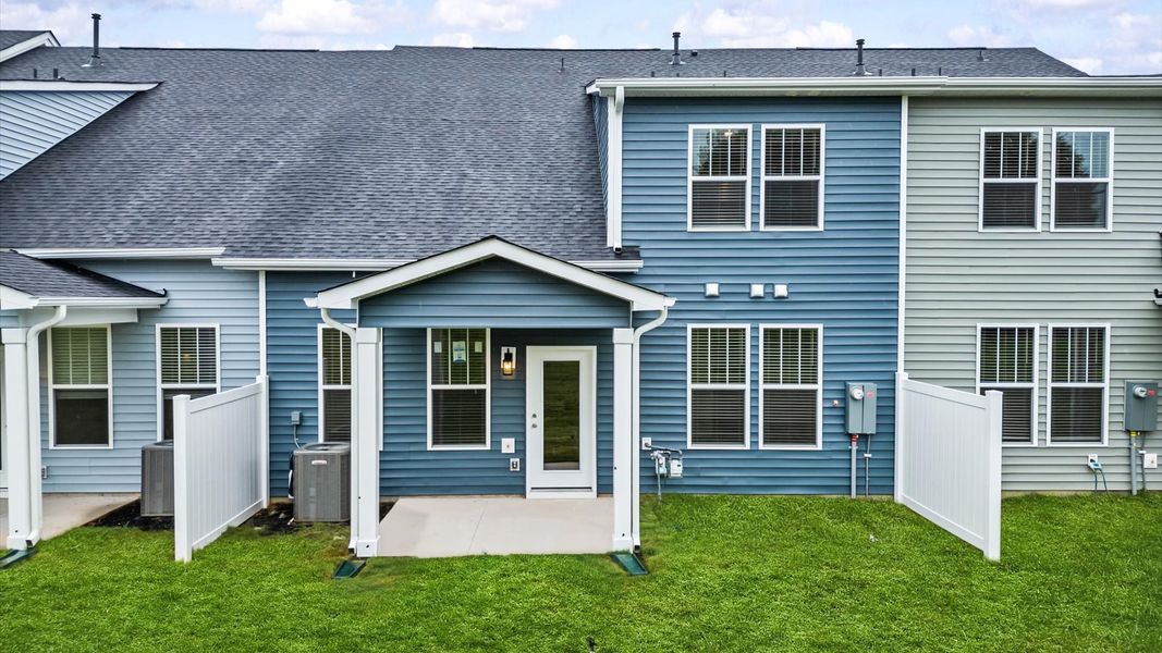 Vibrant rear outdoor space featuring a covered porch and exceptional craftsmanship at Silo Ridge by DRB Homes in Anderson, SC