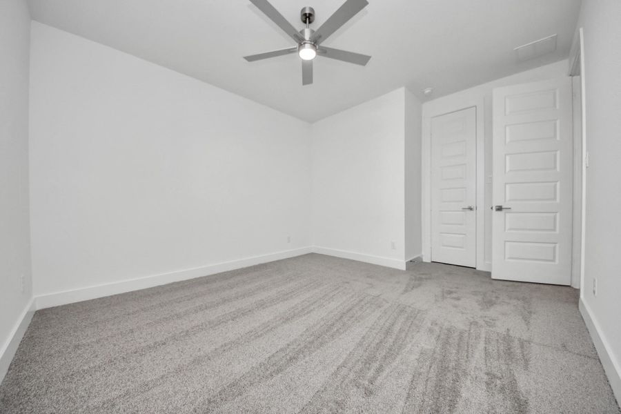Generously sized secondary bedrooms featuring spacious closets, soft and inviting carpeting underfoot, large windows allowing plenty of natural light, and the added touch of privacy blinds for your personal retreat.