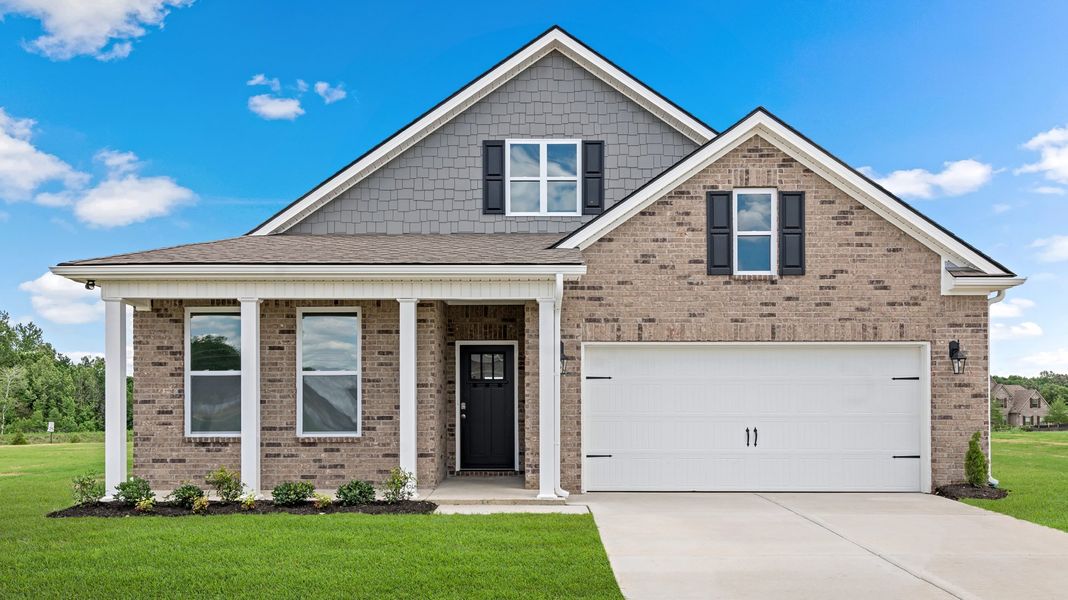 Front exterior of a new home in The Orchard, Millington, TN, highlighting curb appeal (Image 1).