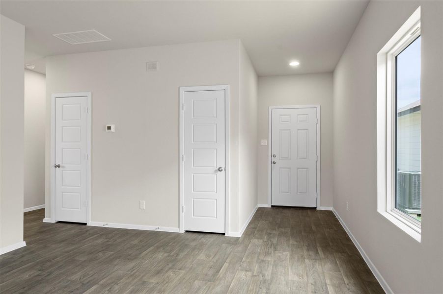 Unfurnished bedroom with wood finished floors and recessed lighting Unfurnished bedroom with wood finished floors and recessed lighting