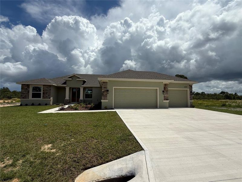 Front exterior of a new home in , Sebring, FL, highlighting curb appeal (Image 2).