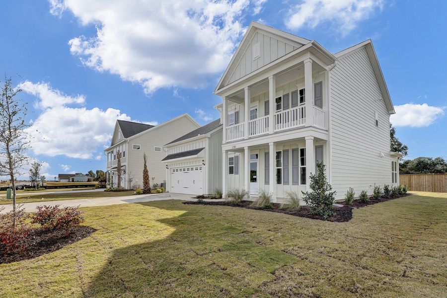 Front exterior of a new home in East Wynd, Hampstead, NC, highlighting curb appeal (Image 2).