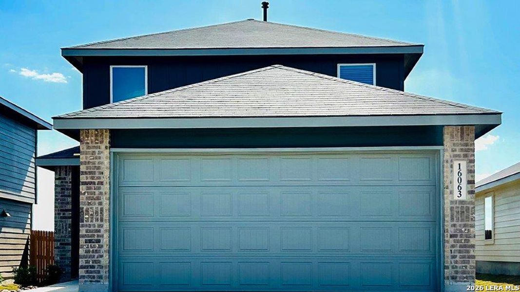 Front exterior of a new home in Hickory Ridge, Elmendorf, TX, highlighting curb appeal (Image 2).