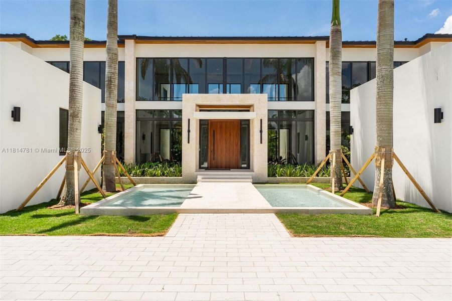 Front exterior of a new home in , Pinecrest, FL, highlighting curb appeal (Image 39).