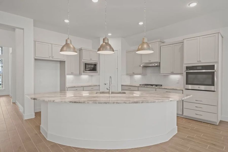 Representative furnished interior of a home built from the Mariah by Chesmar Homes in Lakes of Cane Island, Katy (Image 7).
