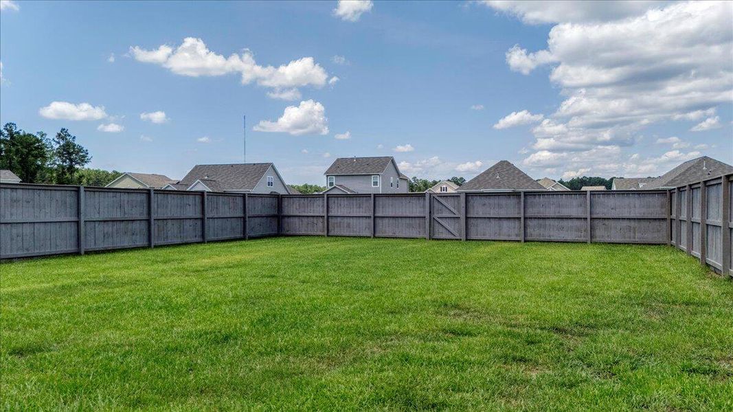 Front exterior of a new home in French Quarter Creek, Huger, SC, highlighting curb appeal (Image 20).