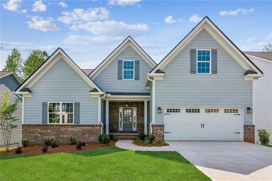 Front exterior of a new home in Traditions of Braselton, Jefferson, GA, highlighting curb appeal (Image 16).