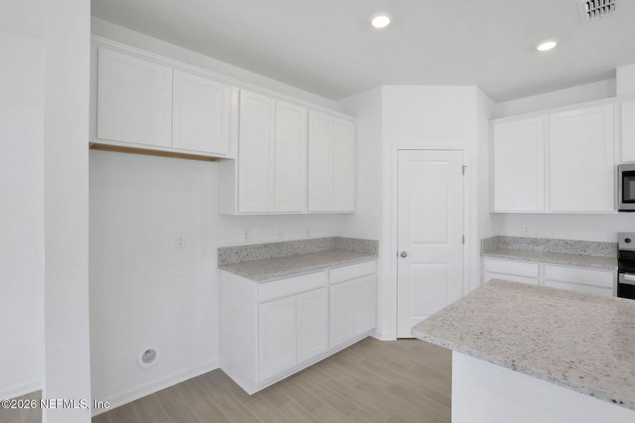 Furnished interior view inside a new home in Amberly, Green Cove Springs (Image 6).