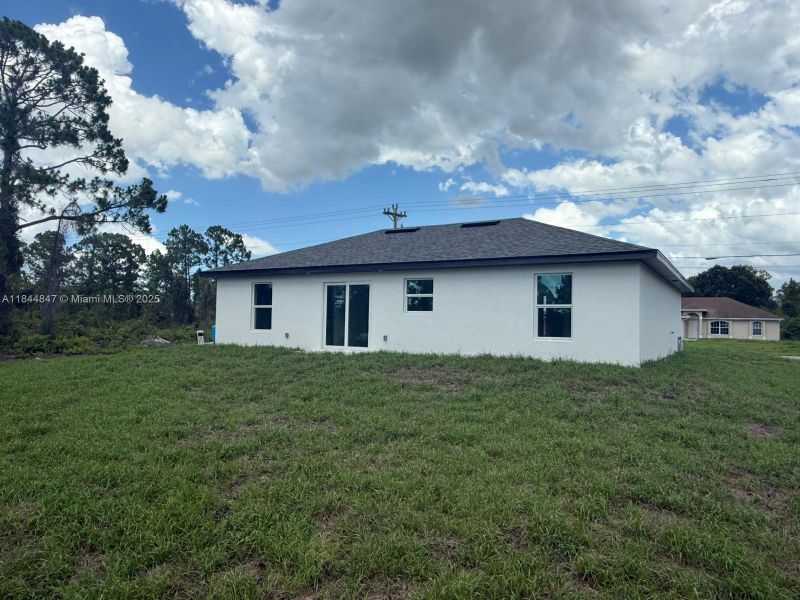 Exterior details and patio area of a home in , Lehigh Acres (Image 3). Exterior details and patio area of a home in , Lehigh Acres (Image 3).