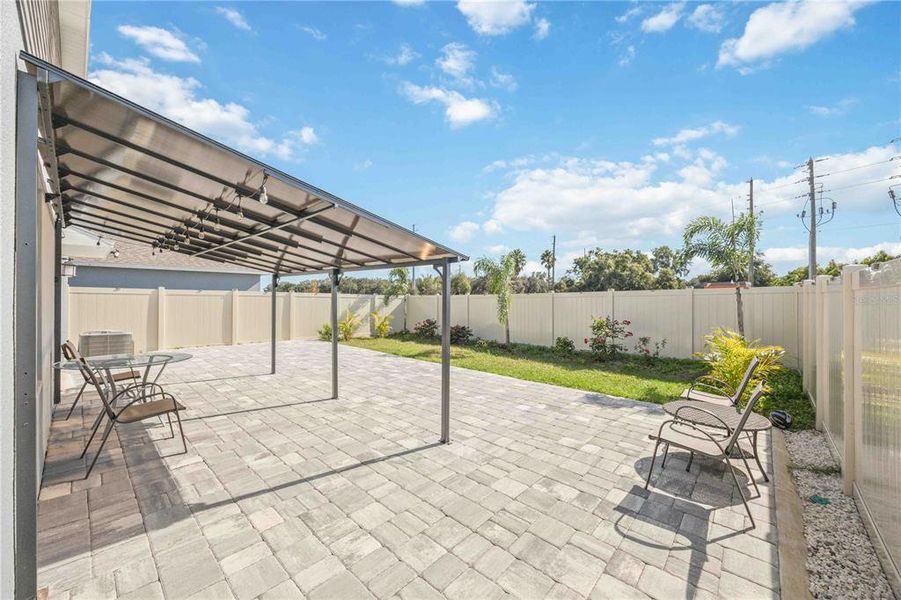 Exterior details and patio area of a home in Peace Creek Reserve: Manor Key Collection, Winter Haven (Image 37).