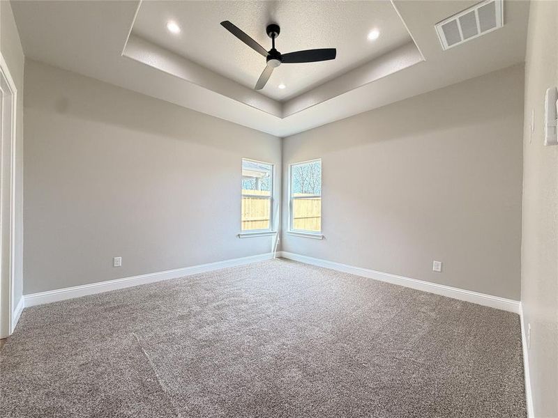 Empty room with a ceiling fan, carpet flooring, and recessed lighting