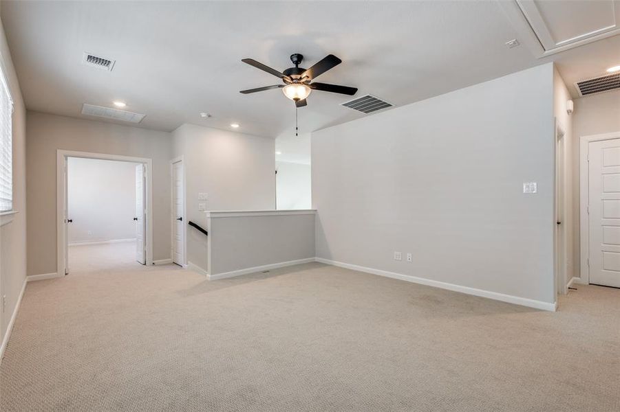 Spare room with recessed lighting, light carpet, and ceiling fan
